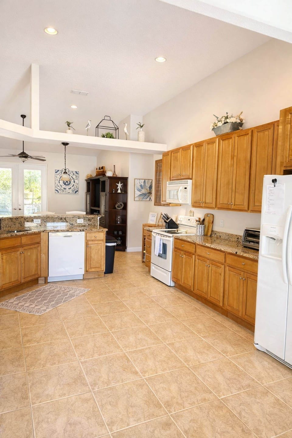 Massive kitchen with expansive granite counters, tons of prep space, and endless storage
