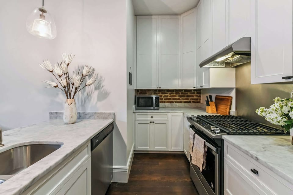 Unit 302 | Open Concept Chef's Kitchen | Third Floor | Fully Equipped | Gas Range | Bar Seating