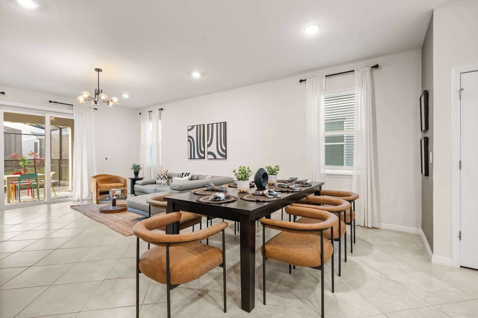 Spacious dining and living area with elegant decor, perfect for family gatherings and relaxation.