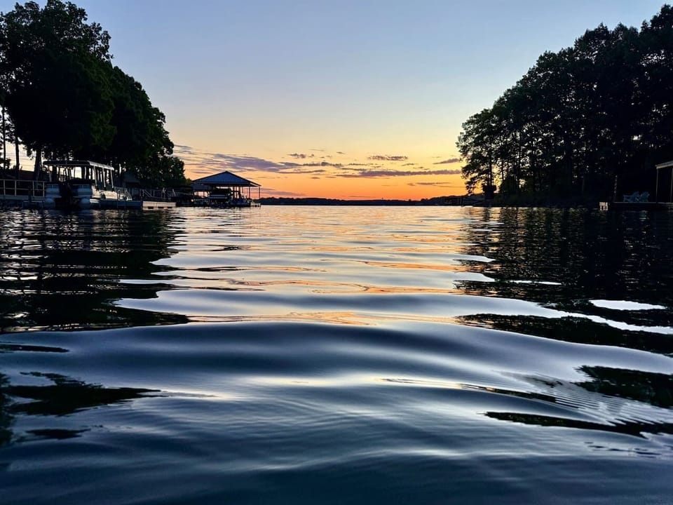 Tucked away in a serene, deep water cove. None of the big wakes of the main channel, making it an easy place to enjoy the lake on a paddle board or take out one of our fishing kayaks.