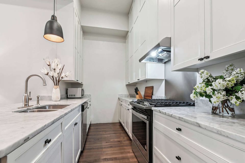 Unit 102 | Open Concept Chef's  Kitchen | First Floor | Fully Equipped | Gas Range | Bar Seating