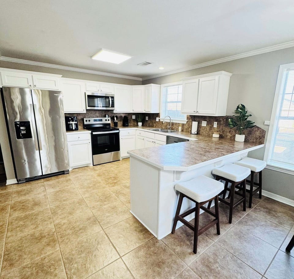 Kitchen island with seating for gathering and dining.