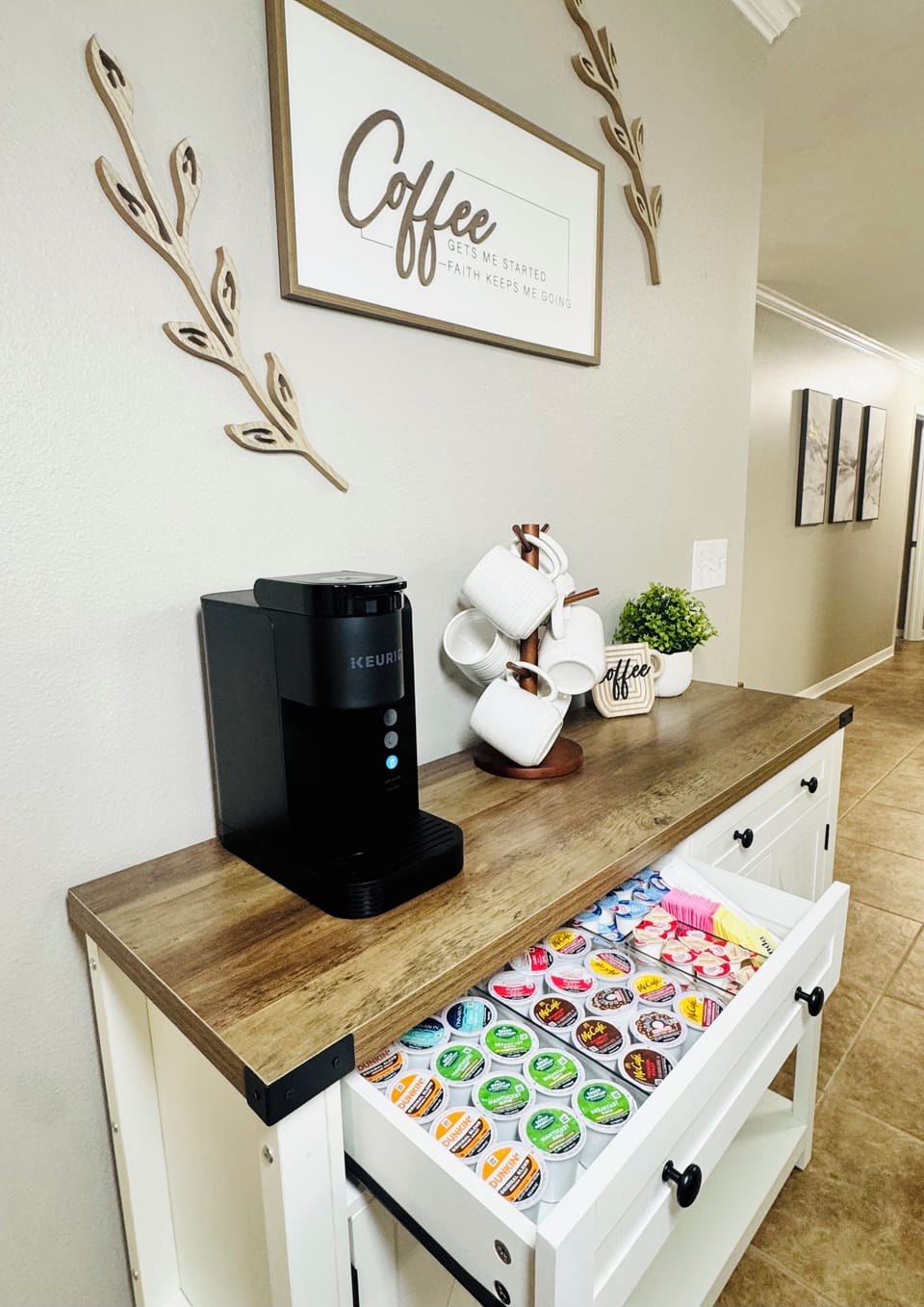 Well stocked coffee bar with Keurig and assorted coffee options.