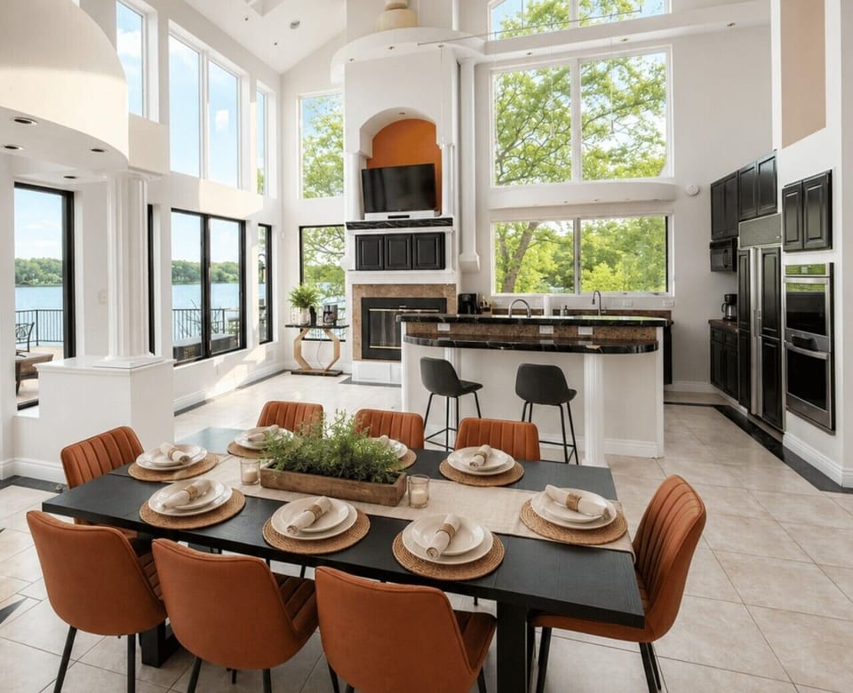 Gather around the table in this bright open-concept kitchen and dining area with beautiful lake views.