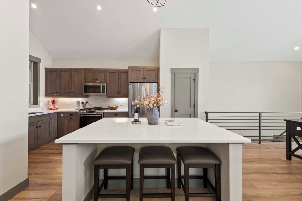 Beautiful kitchen with upscale finishes and kitchen utensils for gourmet meal.