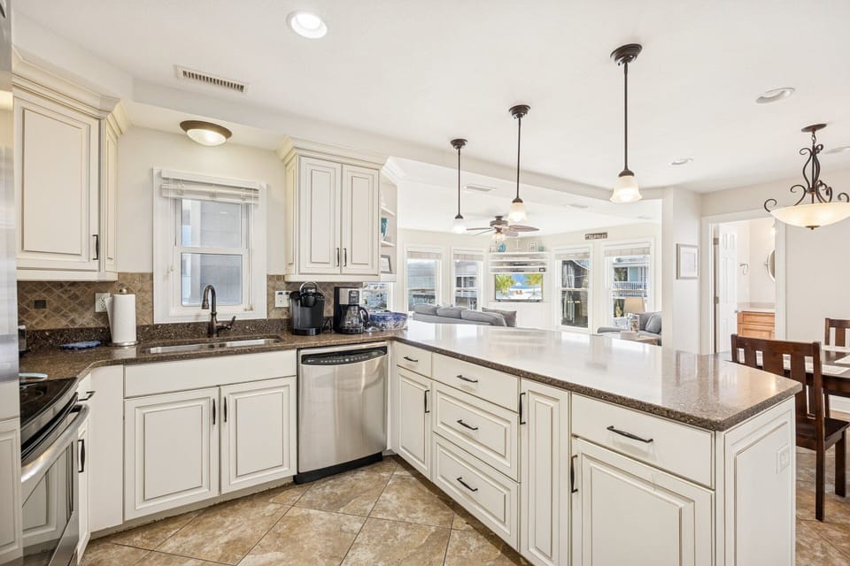 The open-concept kitchen offers plenty of prep space, making it easy to cook and enjoy meals together.