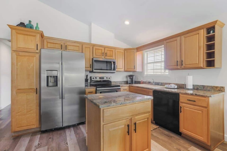 Fully stocked kitchen with stainless appliances