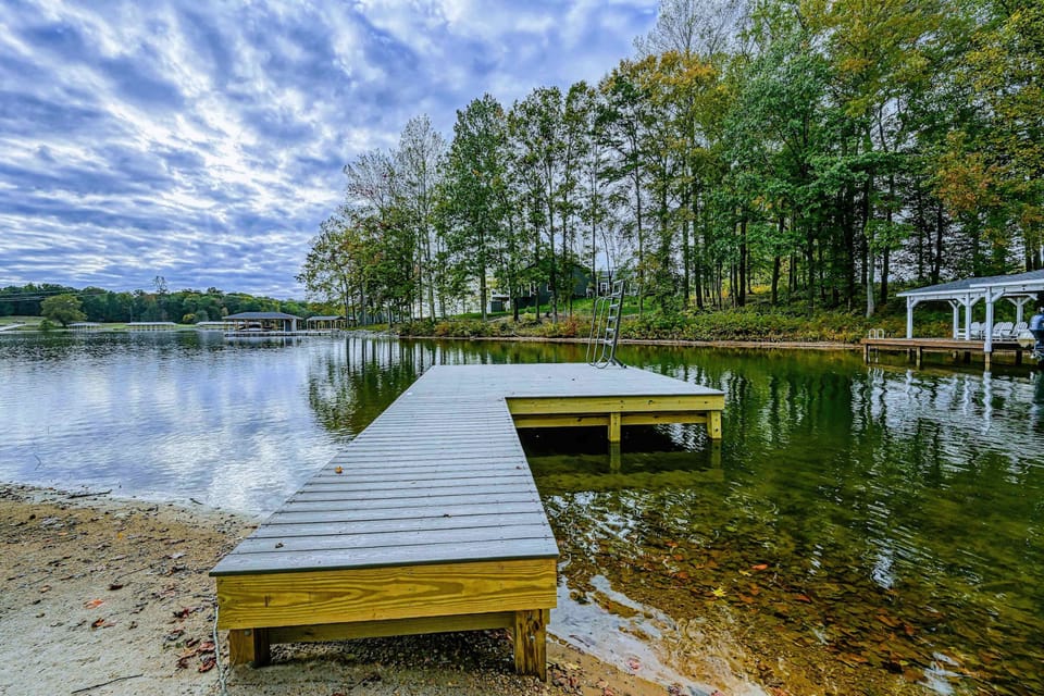 Dock - The private dock extends into the lake with colorful fall foliage lining the shoreline.