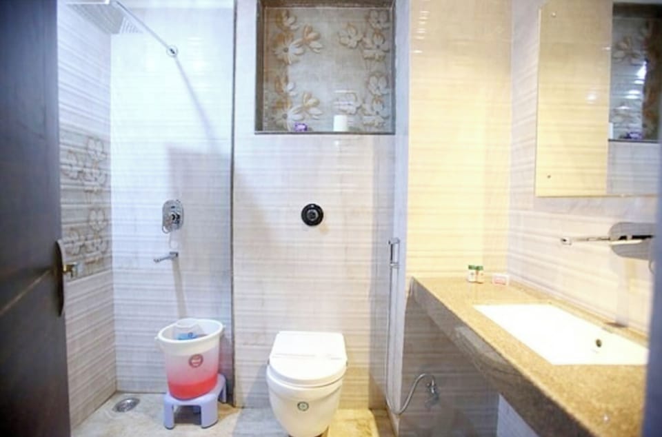 Shower, rainfall showerhead, slippers, towels