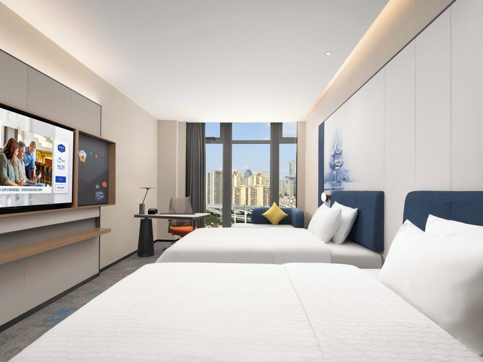 Business Twin Room, City View | Desk, laptop workspace, blackout drapes, soundproofing