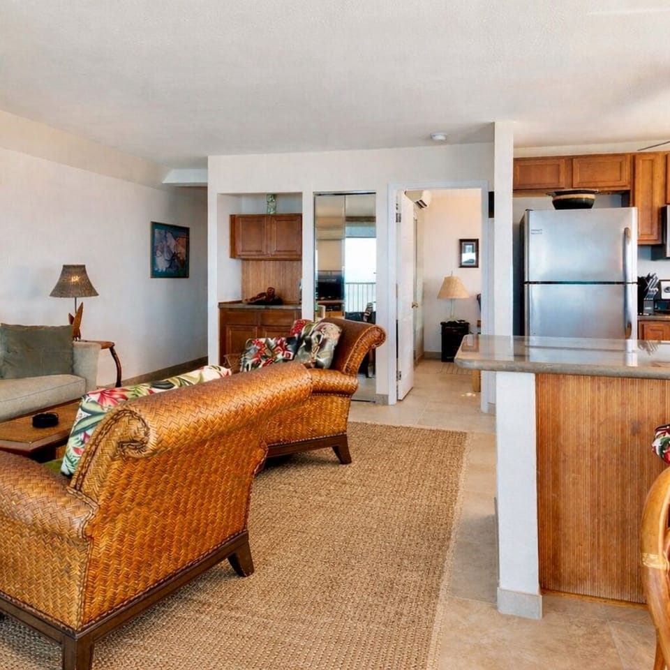 This spacious open, airy living room with plenty of natural light & ocean views.