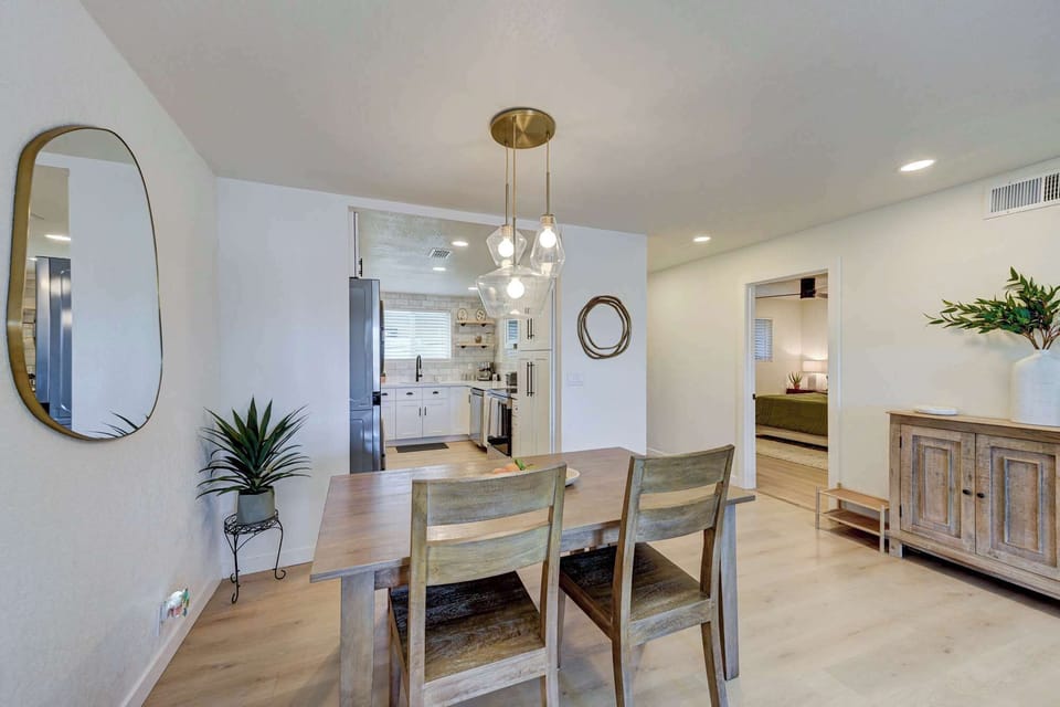 Comfortable dining space with table seating for six, plus flexible seating and extra chairs on hand.
