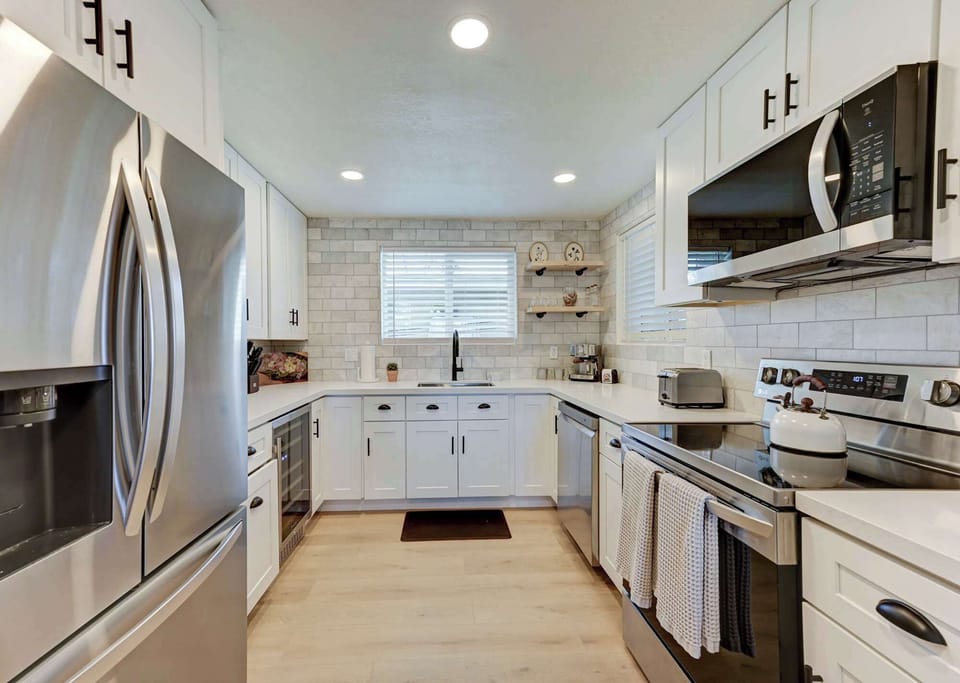 Modern kitchen with stainless steel appliances and generous workspace