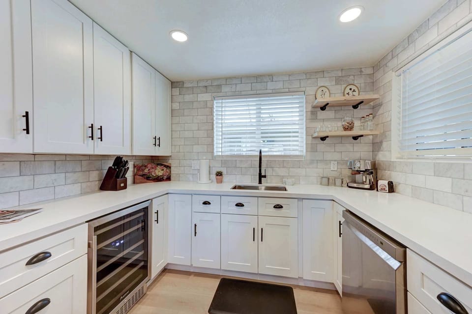 Fully equipped kitchen with modern appliances, espresso machine and ample counter space