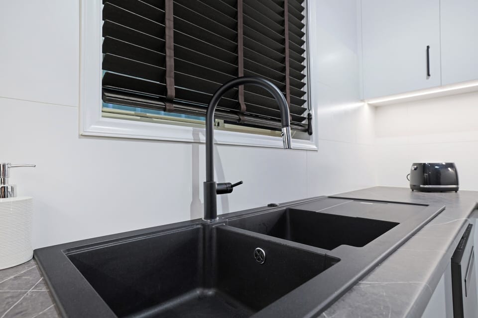 Sink detail showing clean finishes and practical kitchen layout.