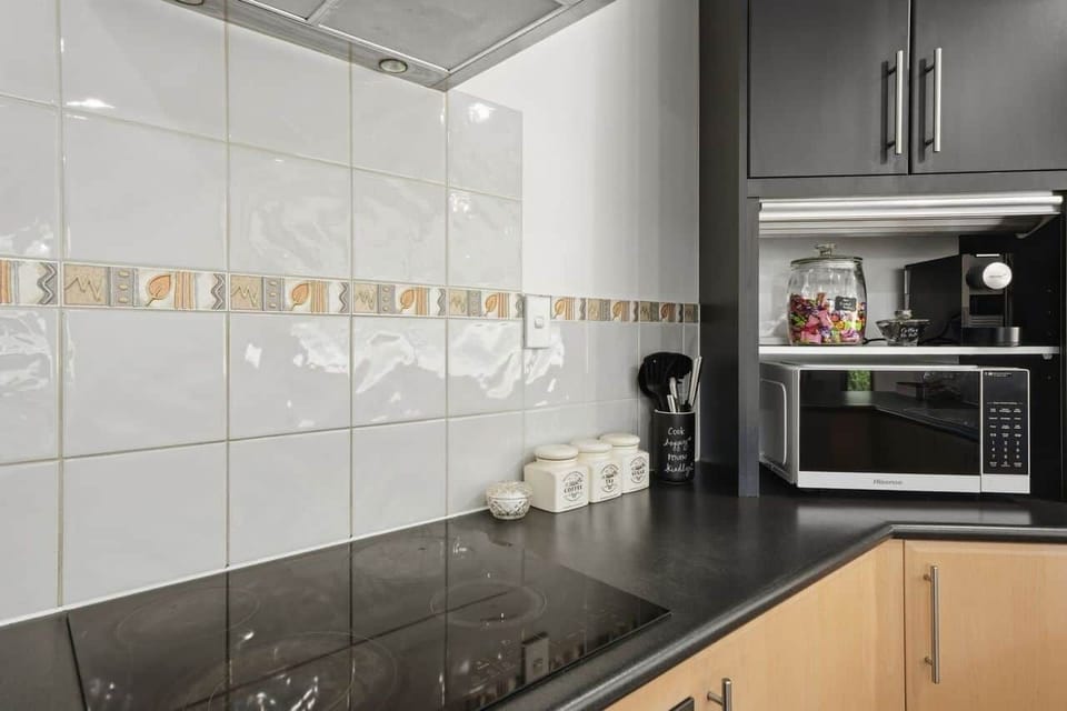 Practical kitchen space with everything needed for preparing meals.