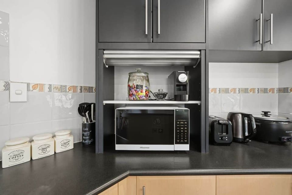 Practical kitchen space with everything needed for preparing meals.