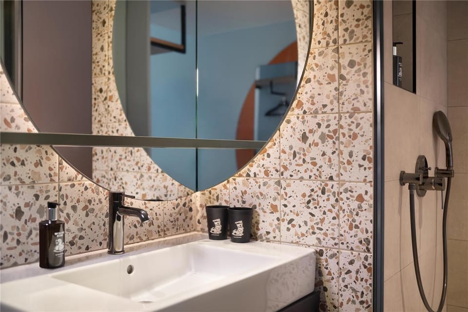 Shower, rainfall showerhead, hair dryer, towels