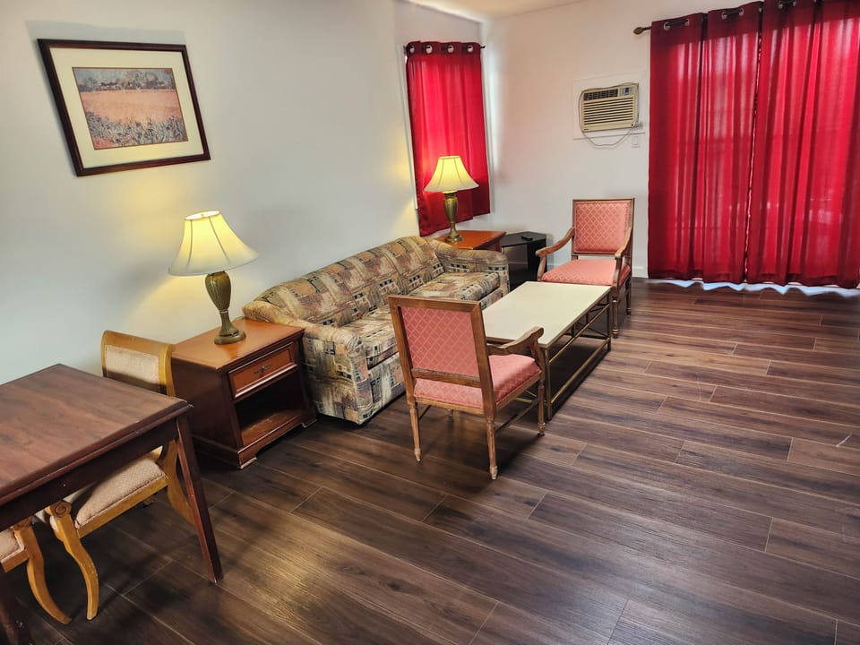 Jacuzzi suites, 2 bedroom | Living area | TV