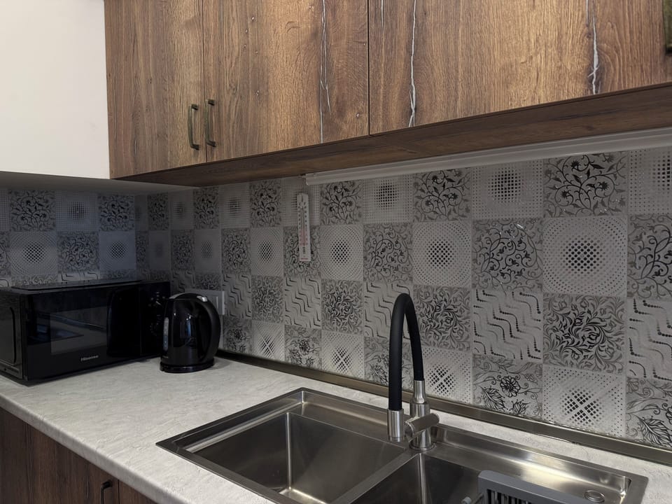 Family Apartment, 2 Bedrooms, Kitchen, Courtyard View | Private kitchen | Highchair