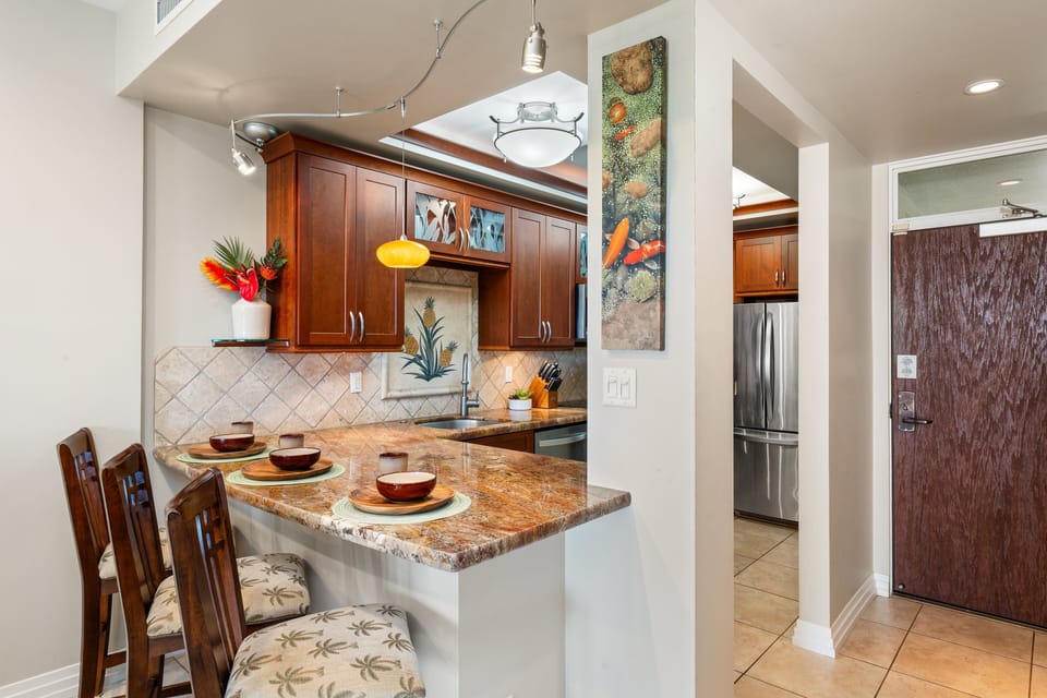 Enjoy casual dining at the breakfast bar, conveniently positioned next to the fully equipped kitchen.