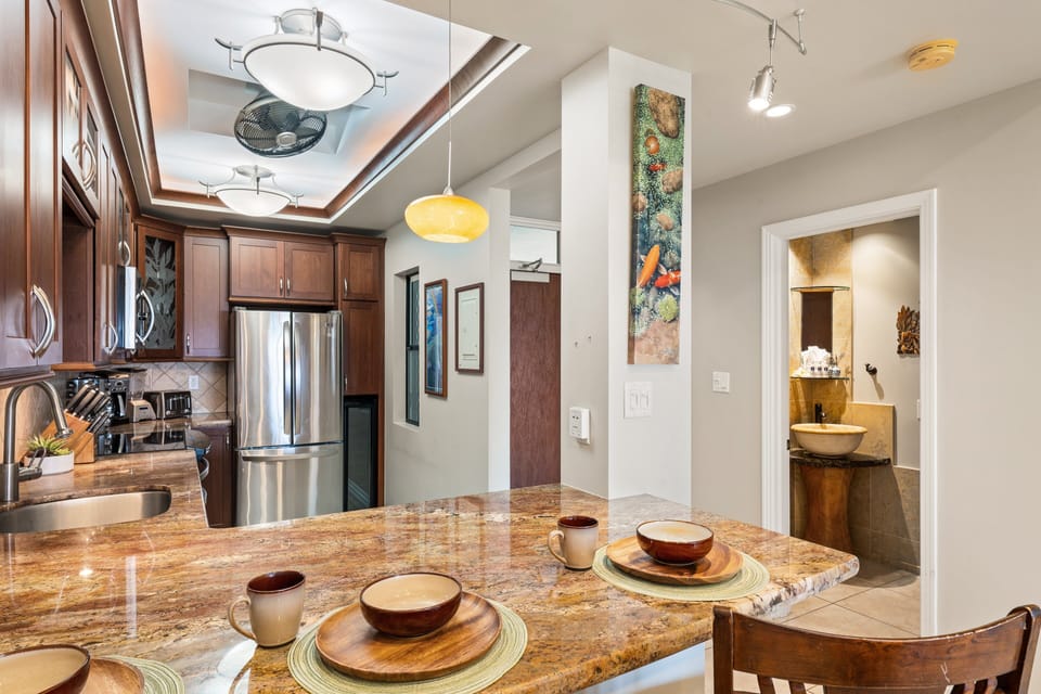 This inviting breakfast bar offers a comfortable spot to eat, chat, or unwind while meals are being prepared.