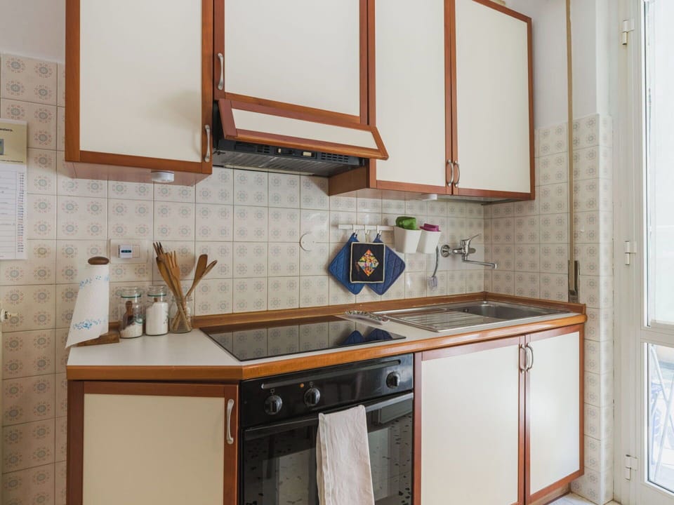 Wood, Kitchen, Cabinetry, Major Appliance, Interior Design, Flooring, Kitchen Appliance, Countertop, Lighting, Floor