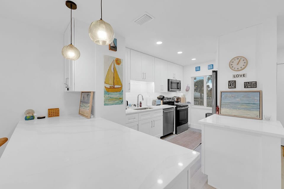 Newly Remodeled Kitchen has a breakfast bar for two.