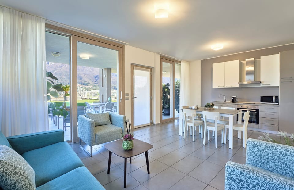 Apartment, Lake View | Living area | Flat-screen TV