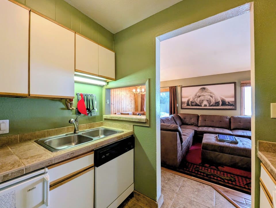 Your cozy kitchen features everything you need to prepare meals, with comfortable living space just steps away for relaxing together.