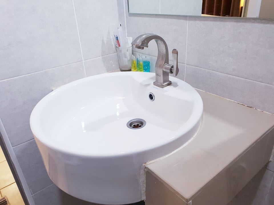 Shower, free toiletries, slippers, towels