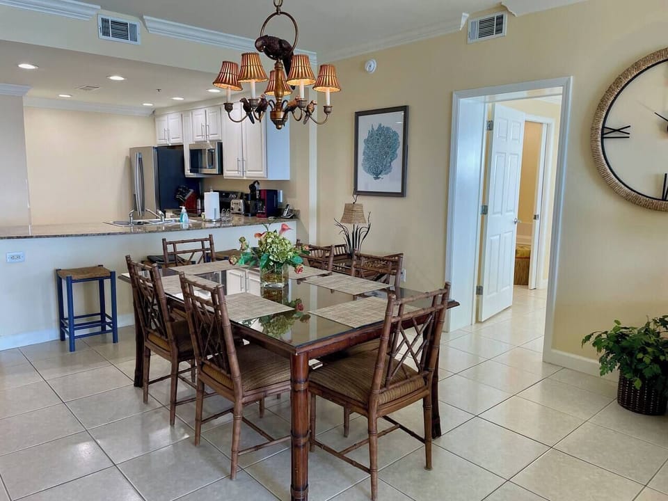 Gather around the table for meals, games, or planning tomorrow’s beach day.