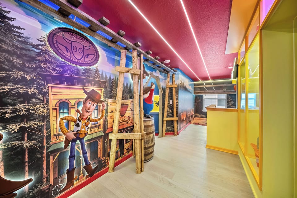Experience a playful atmosphere with vibrant walls and whimsical characters that add adventure to your stay. Bright yellow accents and sleek lighting create an energetic vibe, making it ideal for families and friends.