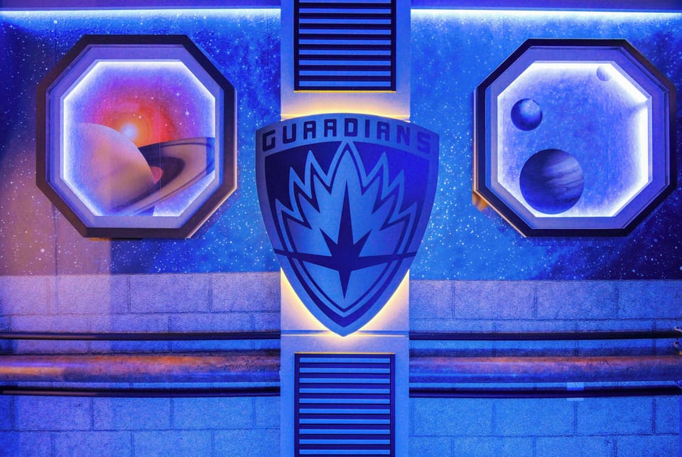 Enter a vibrant space with a stunning blue backdrop and celestial artwork. The glowing graphics create a futuristic vibe, ideal for guests seeking a unique and relaxing experience.