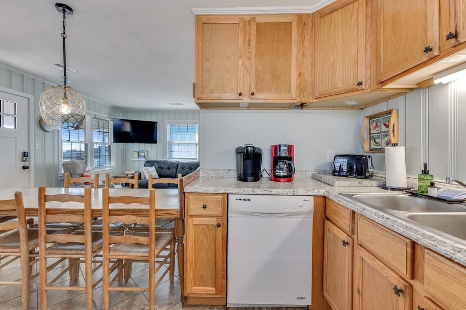 Cook together in your fully equipped kitchen with granite counters, modern appliances, and cozy dining space.