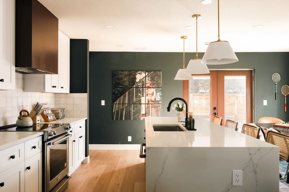 Fully equipped chef`s kitchen with designer finishes and bar seating