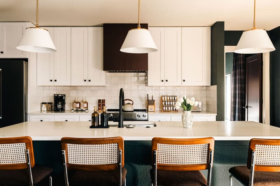 Fully equipped chef`s kitchen with designer finishes and bar seating