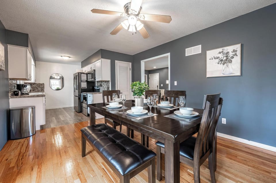 Dining area thoughtfully set with placemats, real plates, and glassware. Perfect