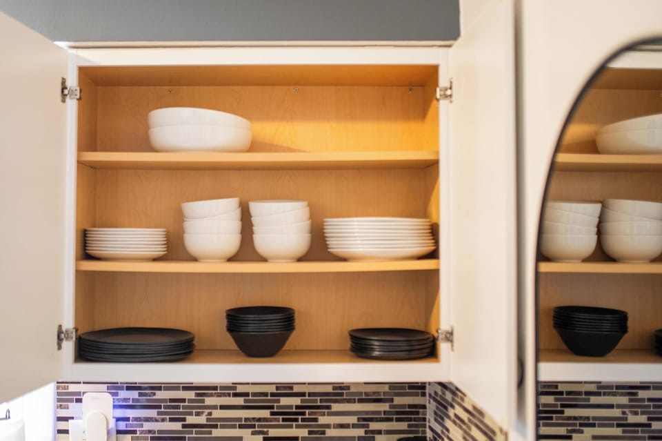 Fully stocked with real plates, bowls, and serving dishes, plus kid-friendly pla