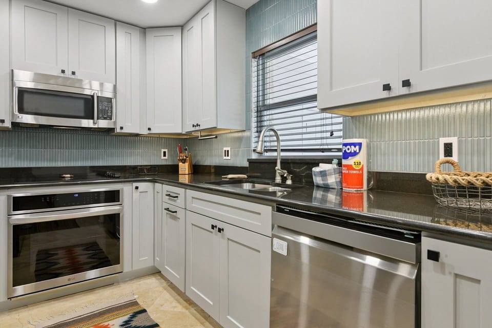 Stylish coastal kitchen with ample counter space and all the essentials for home cooking