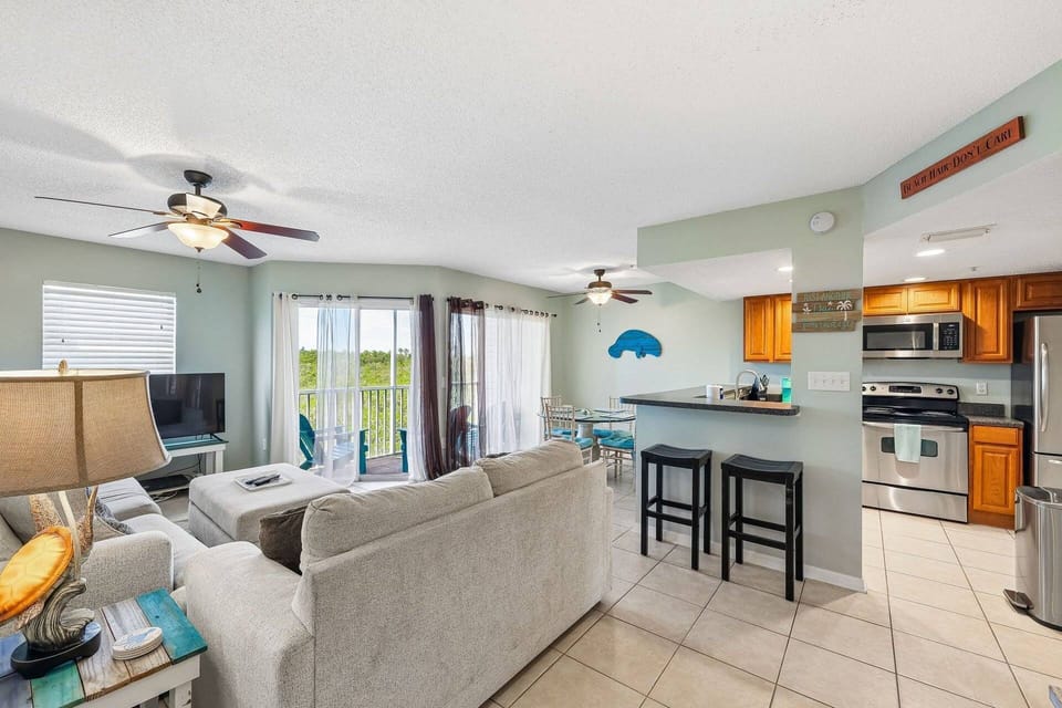 Open layout connecting the living room, dining area, and kitchen