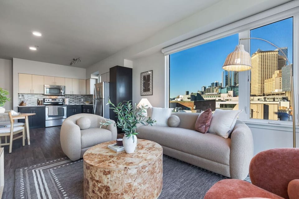 Bright, stylish living space with panoramic city views.