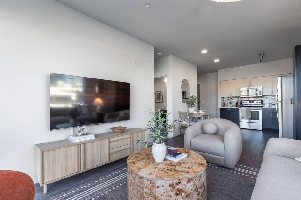 Bright, stylish living space with panoramic city views.