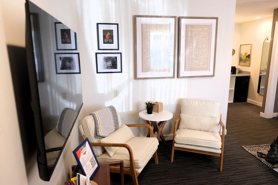 Comfortable seating space inside your Jackrabbit Moab stay—ideal for relaxing after hiking Arches or biking Moab’s world-famous trails.