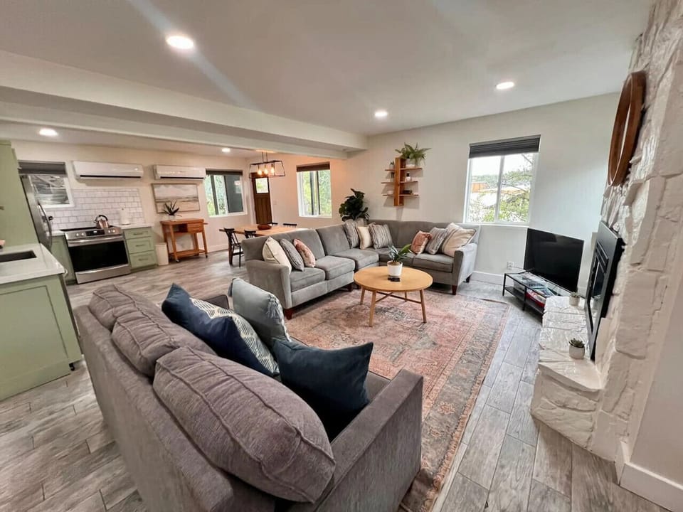 living area featuring comfy couches and a fireplace