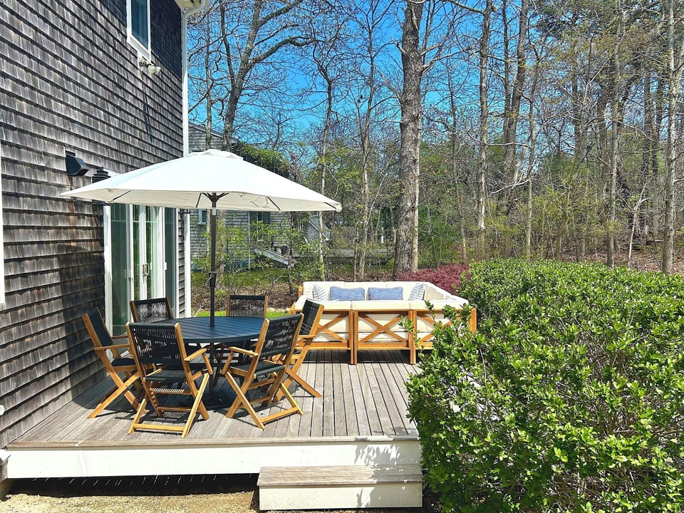 Morning coffee or dinner awaits, with an eight person couch, table and chairs.