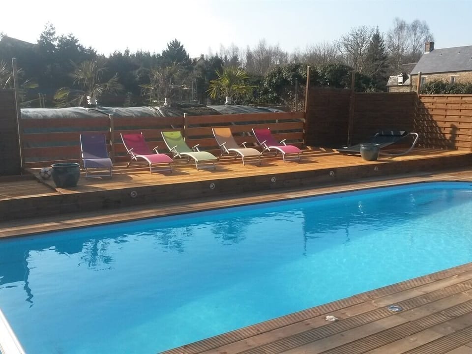 Outdoor pool, a heated pool, sun loungers
