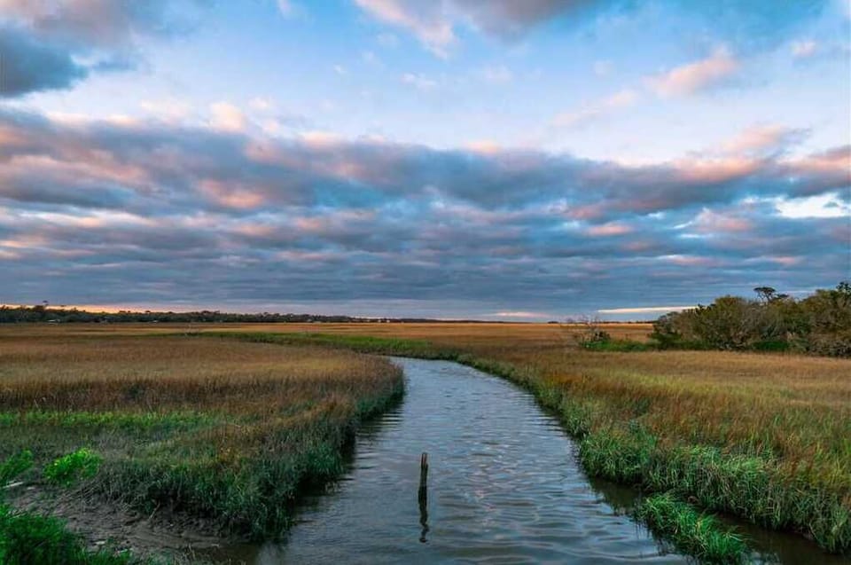 Cloudy sky over the marsh.