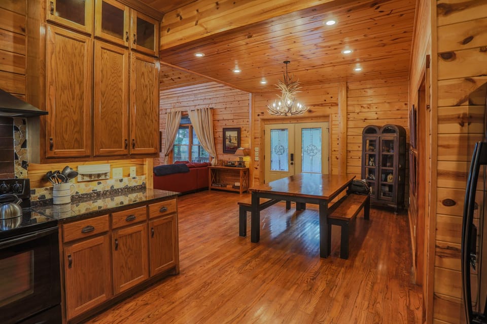 Full master bath suite — vanity, private toilet room, and corner soaking tub