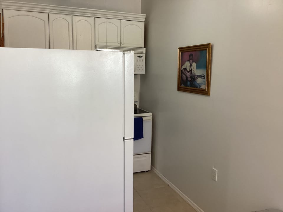 Comfort Condo, Balcony, Garden View | Private kitchen | Coffee/tea maker, full-size fridge, microwave, oven